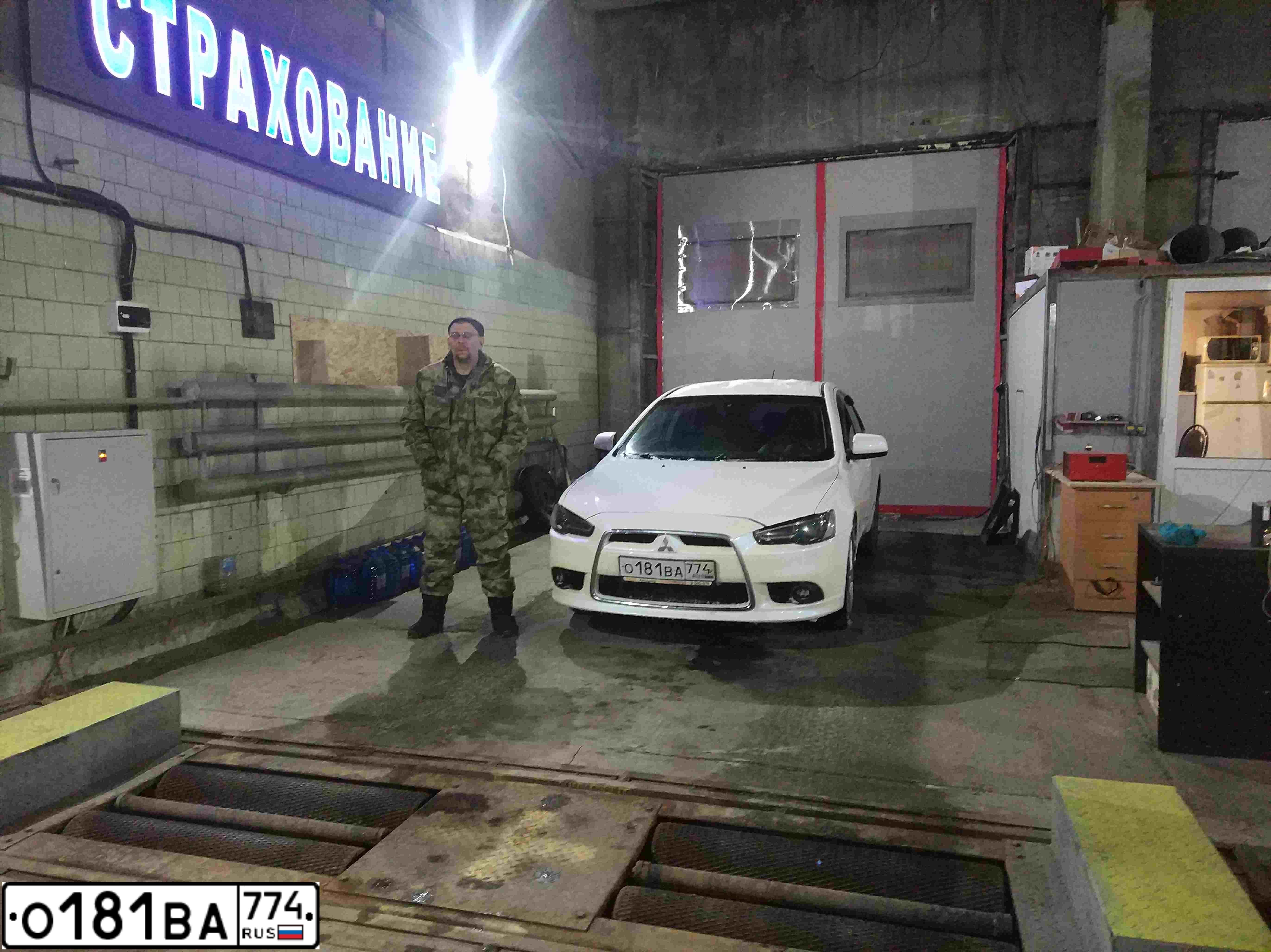 Фото автомобиля MITSUBISHI LANCER, 2008 — госномер О181ВА774. Цвет: Белый