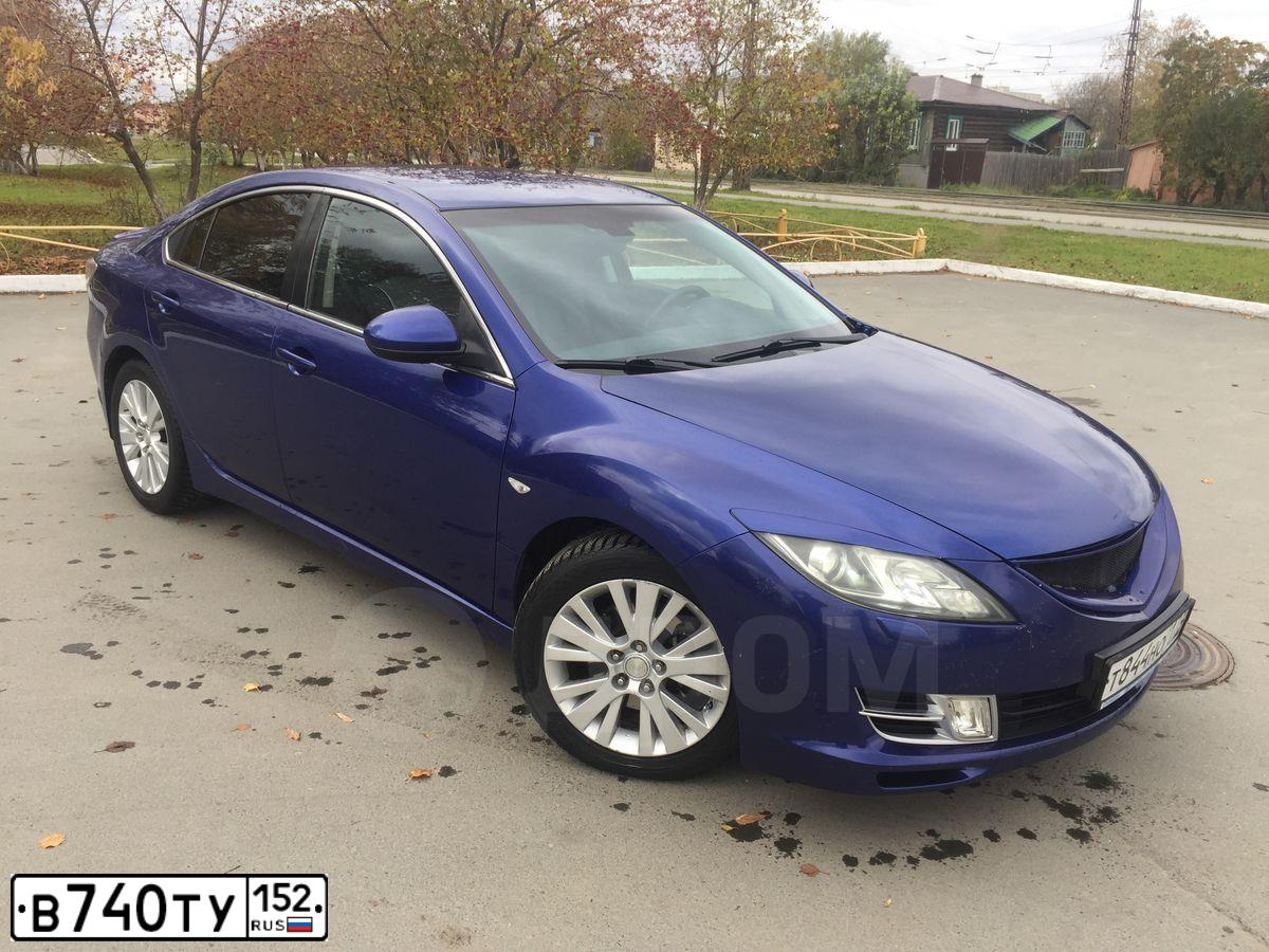 Фото автомобиля MAZDA 3, 2006 — госномер О225ЕЕ29. Цвет: Красный
