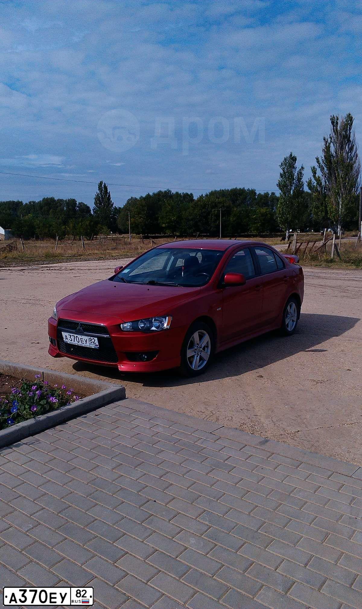 Фото автомобиля MITSUBISHI LANCER, 2008 — госномер В293ВЕ92. Цвет: Красный