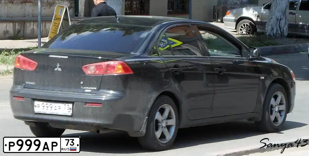 Фото автомобиля MITSUBISHI LANCER, 2007 — госномер Р999АР73. Цвет: ЧЕРНЫЙ