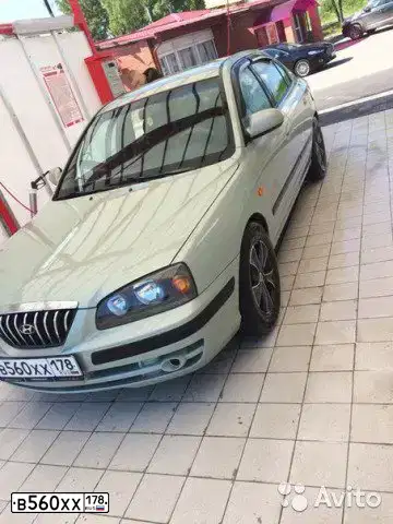 Фото автомобиля HYUNDAI ELANTRA, 2005 — госномер В560ХХ178. Цвет: СВЕТЛО-СЕРО-ЗЕЛЕНЫЙ
