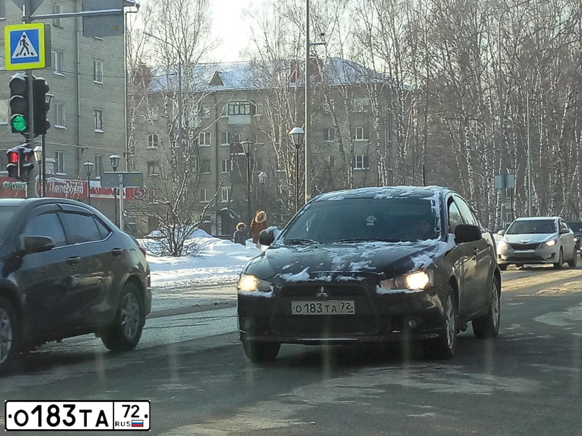 Фото автомобиля MITSUBISHI LANCER, 2012 — госномер О183ТА72. Цвет: ЧЕРНЫЙ