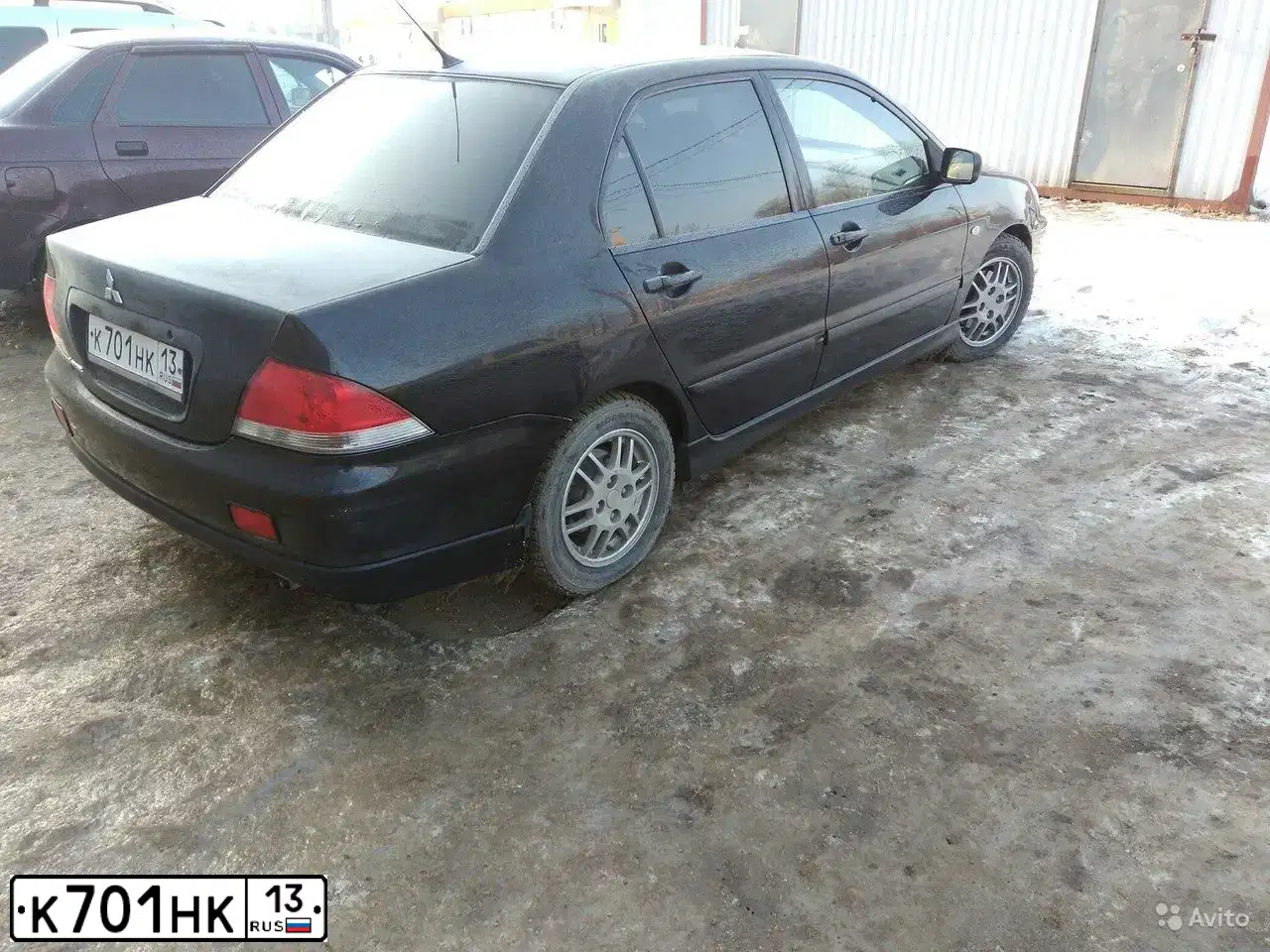 Фото автомобиля MITSUBISHI LANCER, 2007 — госномер К701НК13. Цвет: ЧЕРНЫЙ