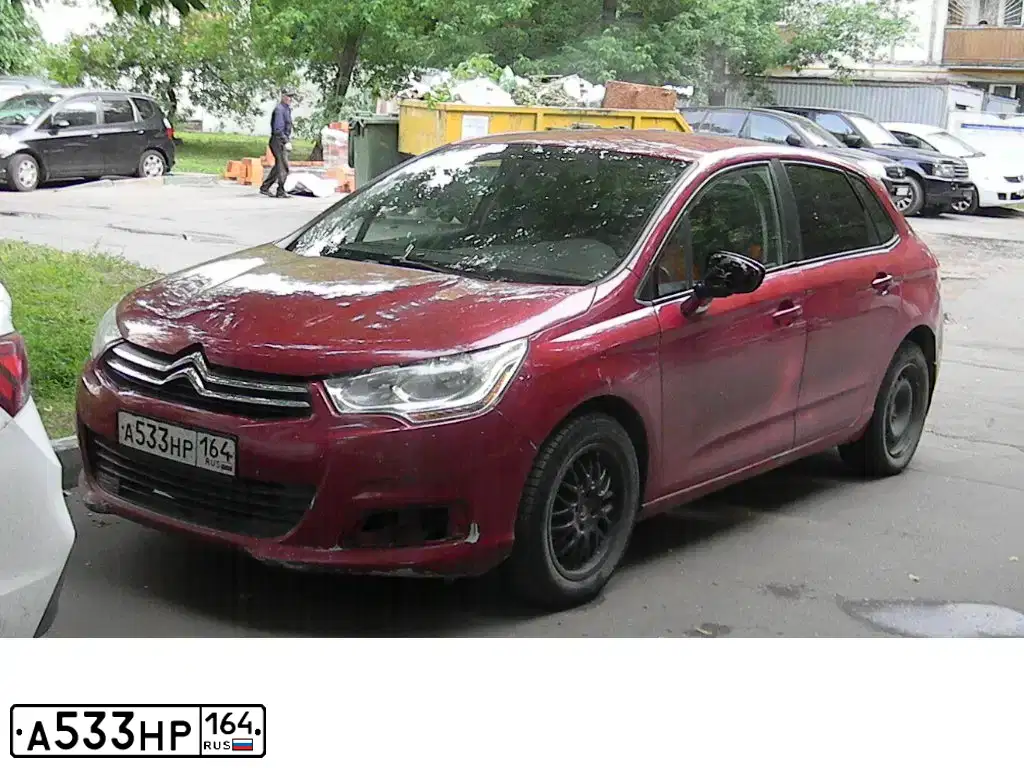 Фото автомобиля CITROEN C4, 2012 — госномер В702РР164. Цвет: Красный