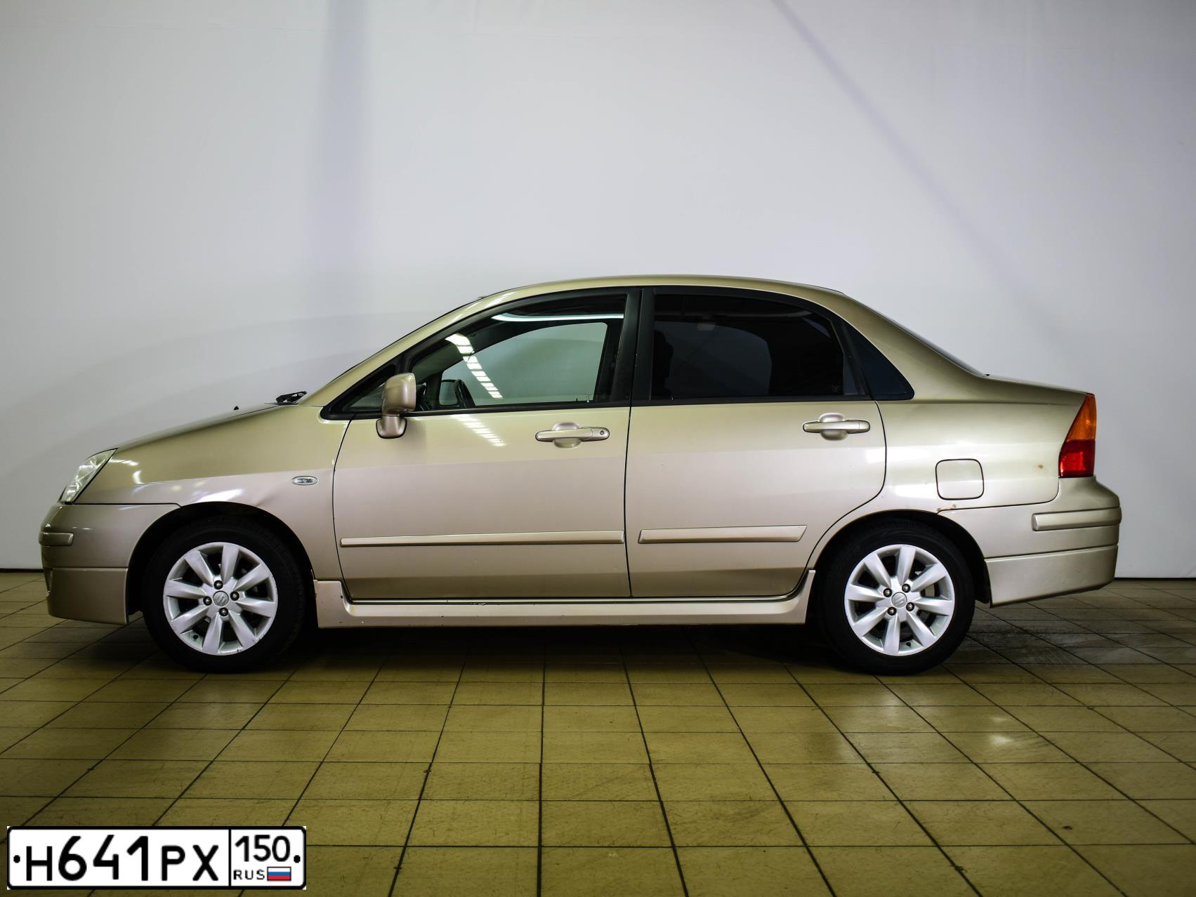Фото автомобиля СУЗУКИ LIANA, 2005 — госномер О545ЕУ32. Цвет: БЕЖЕВЫЙ