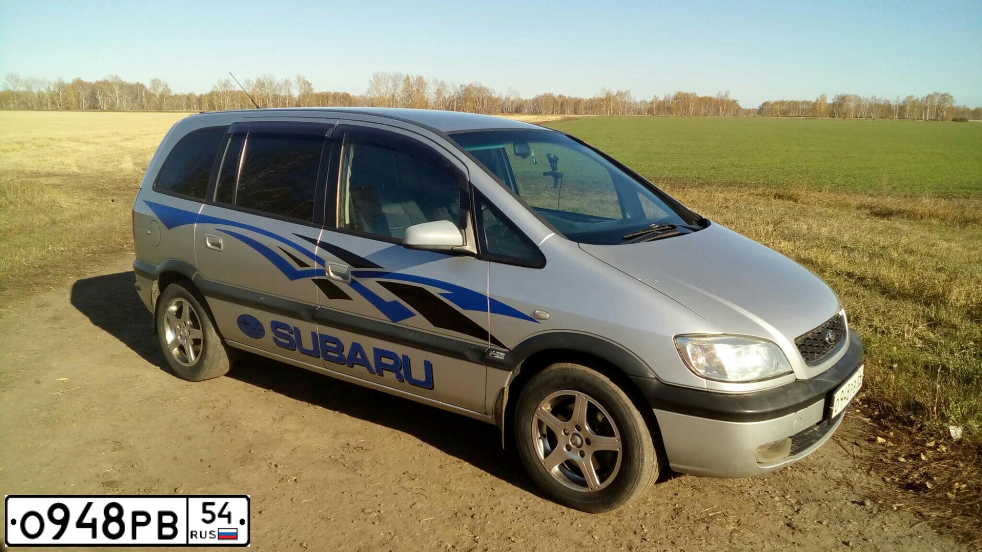 Фото автомобиля SUBARU TRAVIQ, 2001 — госномер О948РВ54. Цвет: СЕРЫЙ
