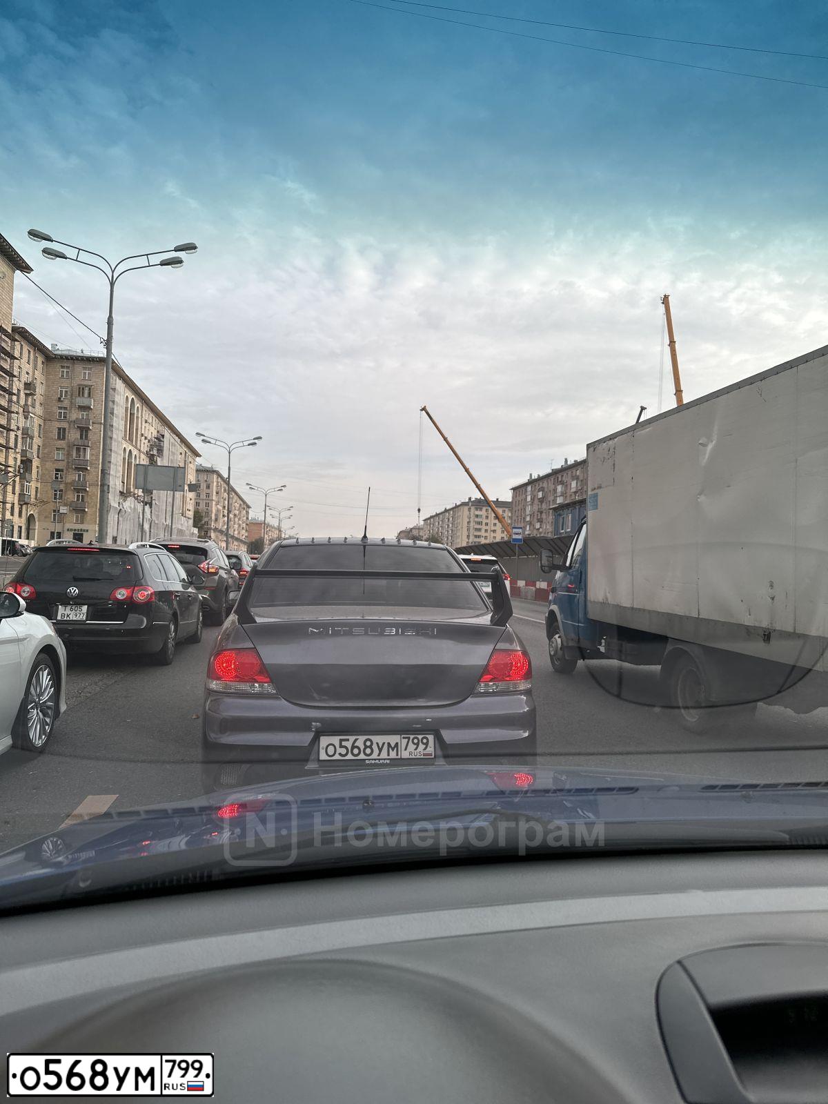 Фото автомобиля MITSUBISHI LANCER, 2006 — госномер Р849КС977. Цвет: СЕРЫЙ