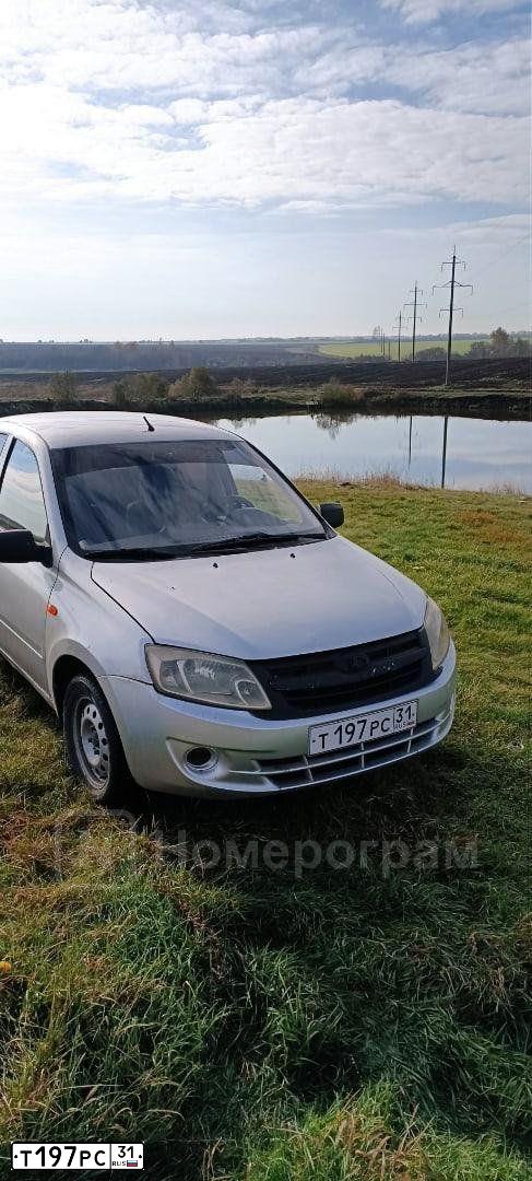 Фото автомобиля LADA 2190 GRANTA, 2013 — госномер Н445КХ31. Цвет: Серебристый