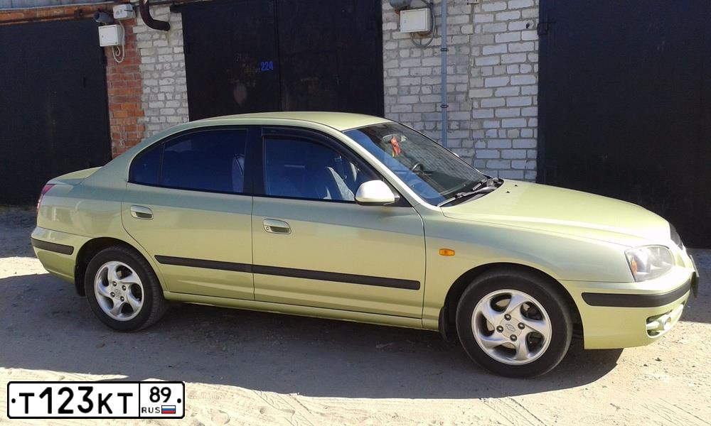 Фото автомобиля HYUNDAI ELANTRA, 2004 — госномер Т123КТ89. Цвет: ЖЕЛТО-ПЕСОЧНЫЙ