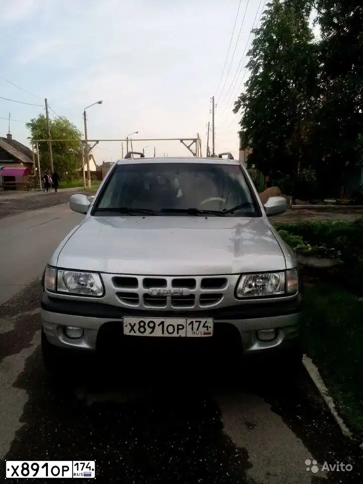 Фото автомобиля OPEL FRONTERA, 1999 — госномер Х891ОР174. Цвет: БЕЛЫЙ СЕРЕБРИСТЫЙ