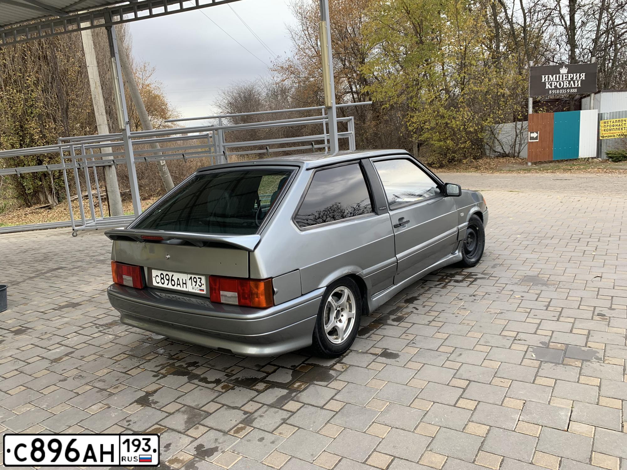 Фото автомобиля LADA 2113 SAMARA, 2006 — госномер Е161АА61. Цвет: СЕРО-ЗЕЛЕНЫЙ МЕТАЛЛИК