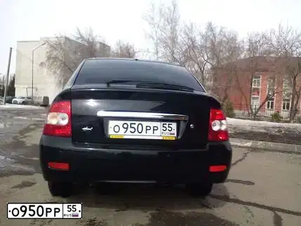 Фото автомобиля LADA PRIORA, 2009 — госномер Х012СЕ55. Цвет: Сине-Черный