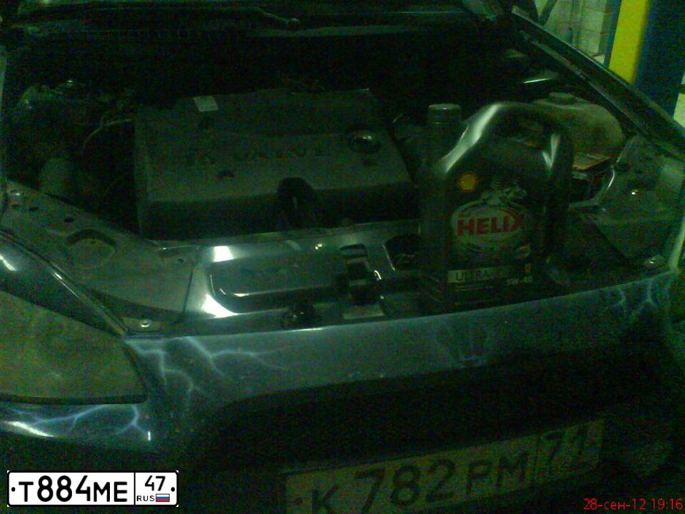 Фото автомобиля CHEVROLET AVEO, 2010 — госномер Е981НР82. Цвет: Красный