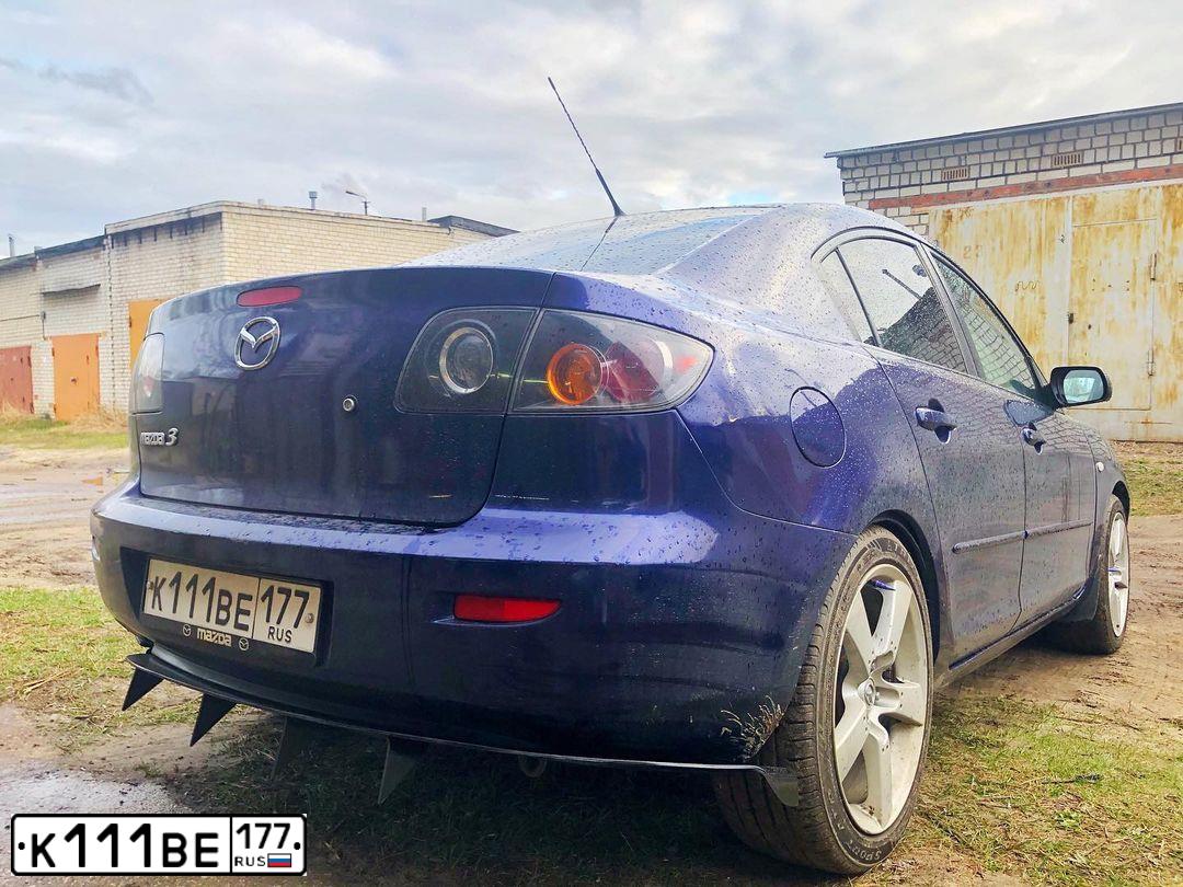 Фото автомобиля FORD FOCUS, 2005 — госномер Н764АС10. Цвет: ЧЕРНЫЙ