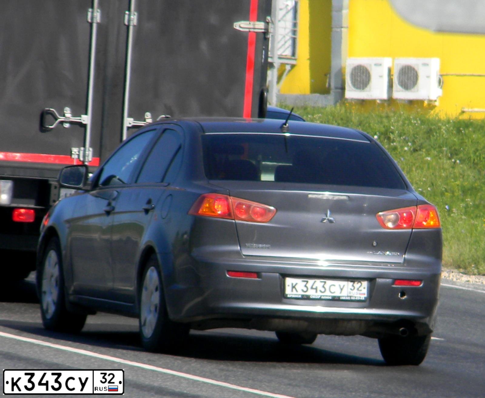 Фото автомобиля MITSUBISHI LANCER, 2008 — госномер В234АМ57. Цвет: СЕРЫЙ