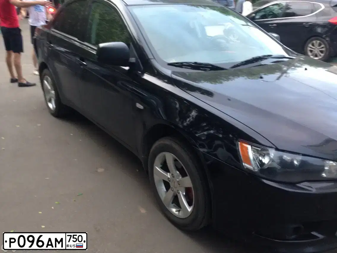 Фото автомобиля MITSUBISHI LANCER, 2014 — госномер Н808АР977. Цвет: ЧЕРНЫЙ