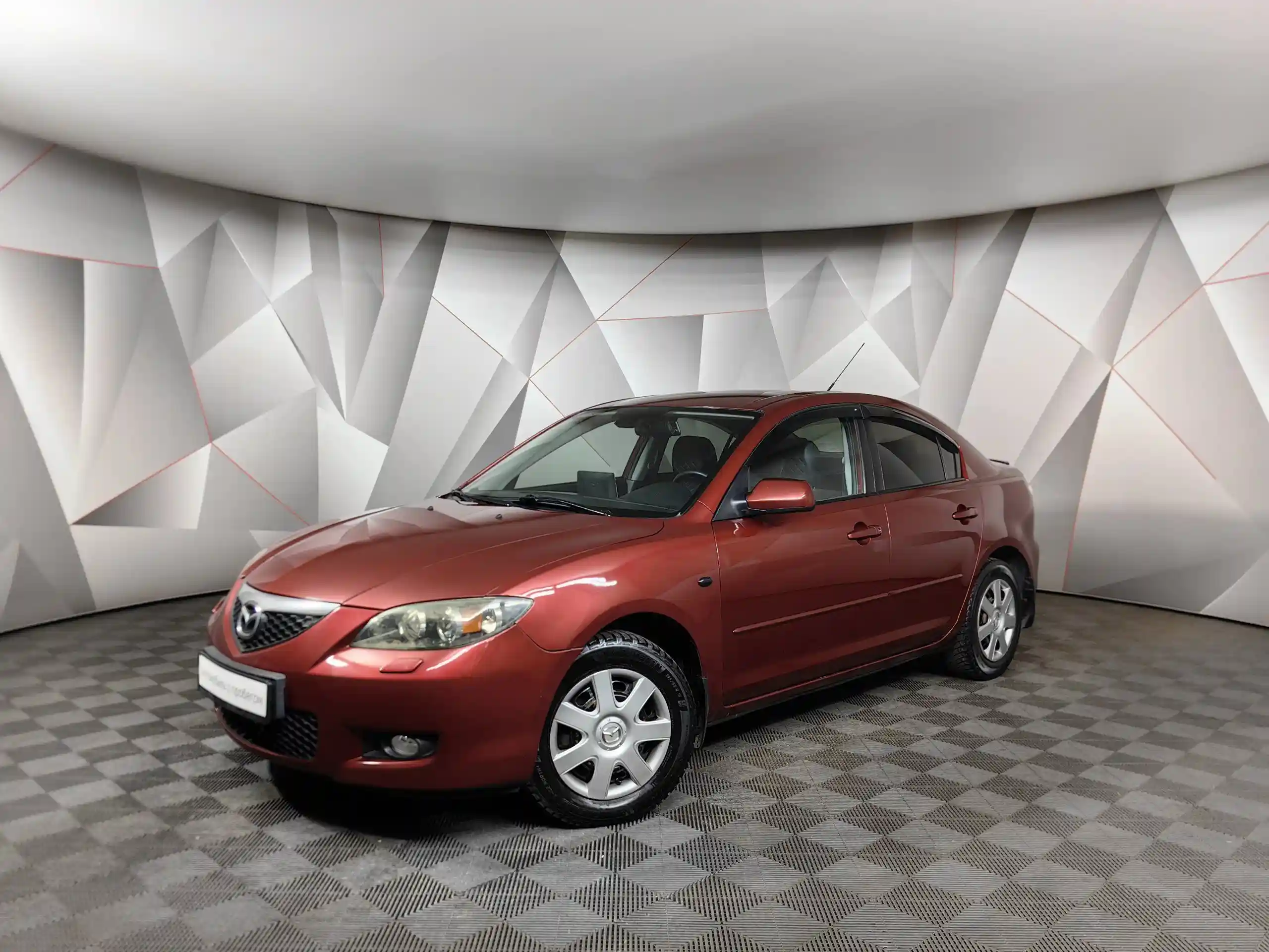 Фото автомобиля MAZDA A 3, 2008 — госномер Н107МР32. Цвет: Красный