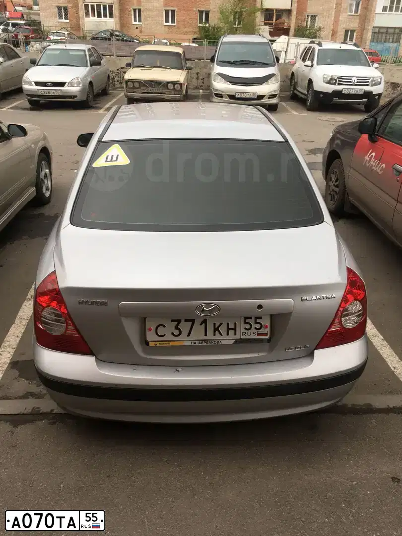 Фото автомобиля TOYOTA PREVIA, 2004 — госномер К325АМ774. Цвет: Серебристый