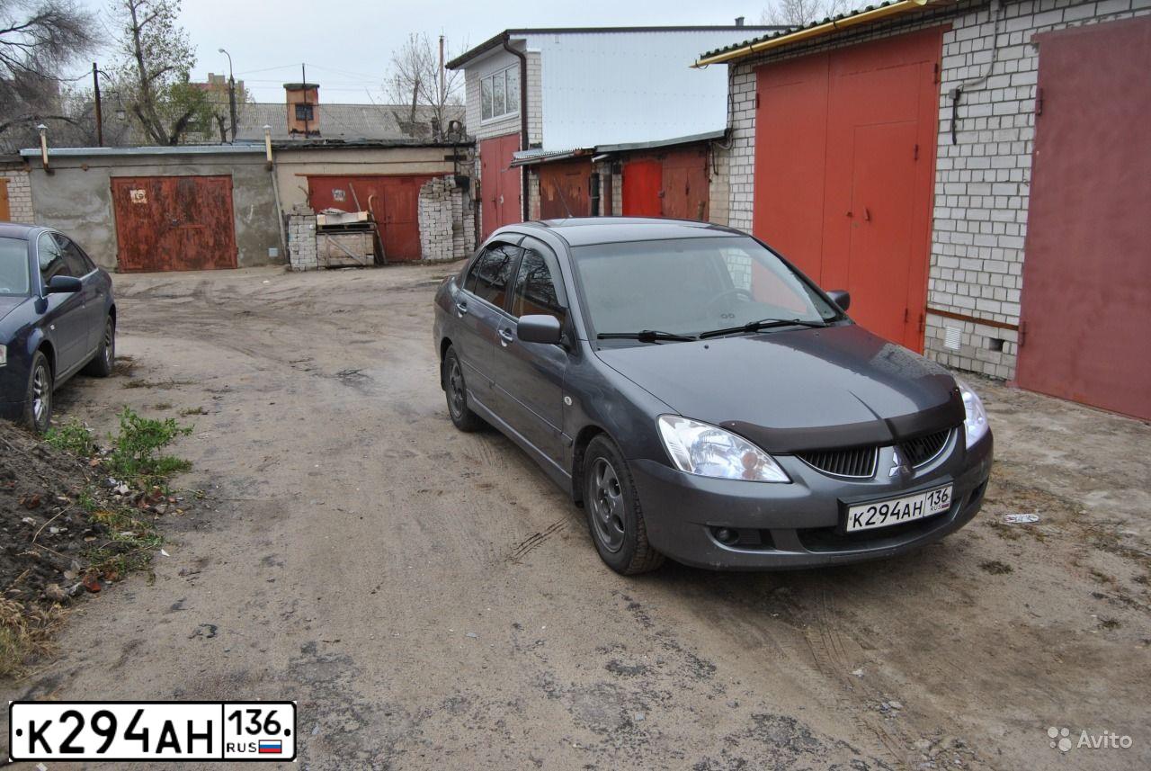 Фото автомобиля MITSUBISHI LANCER, 2004 — госномер Т032МО136. Цвет: СЕРЫЙ
