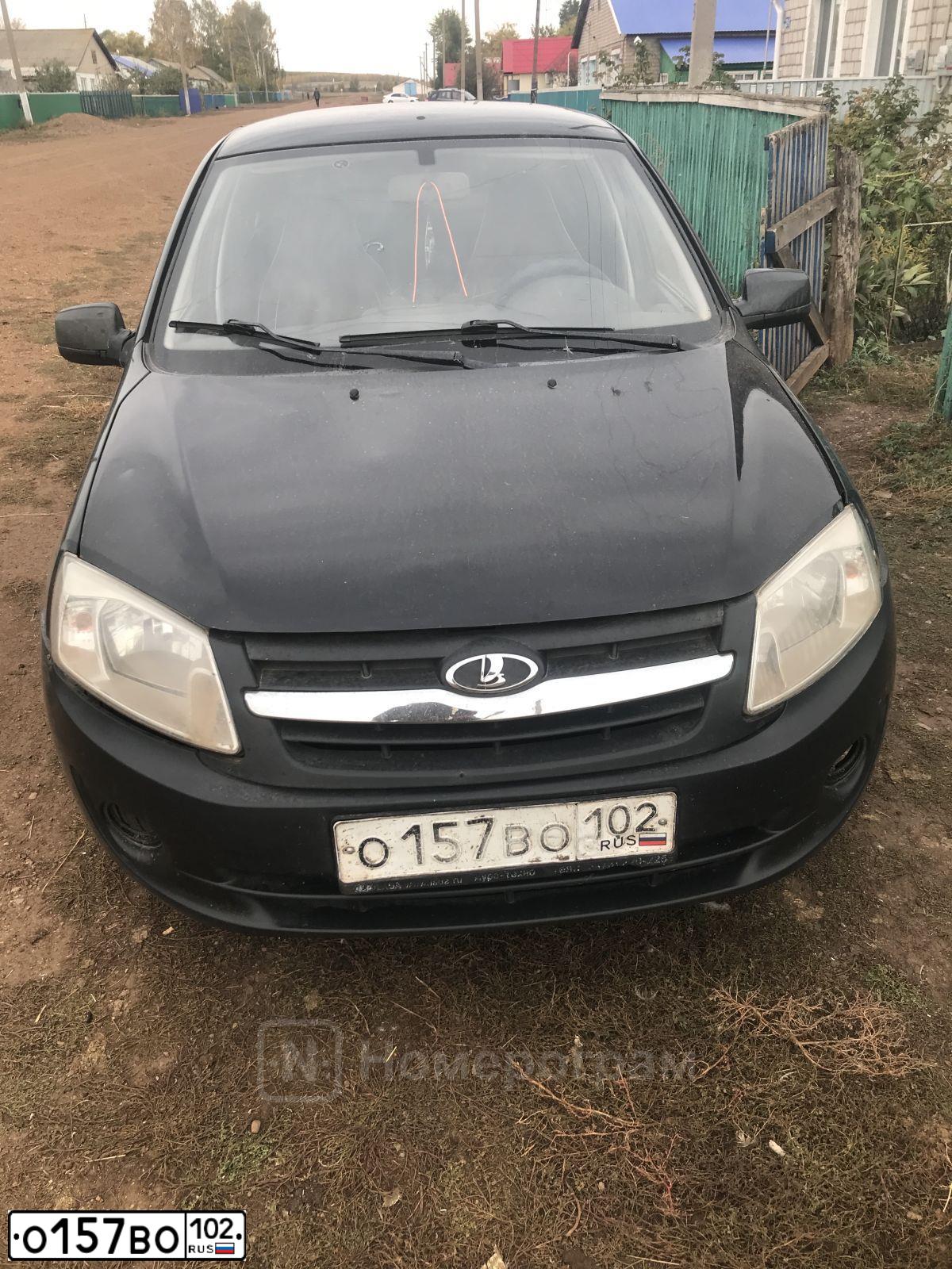 Фото автомобиля LADA 2190 GRANTA, 2012 — госномер О157ВО102. Цвет: ЧЕРНЫЙ