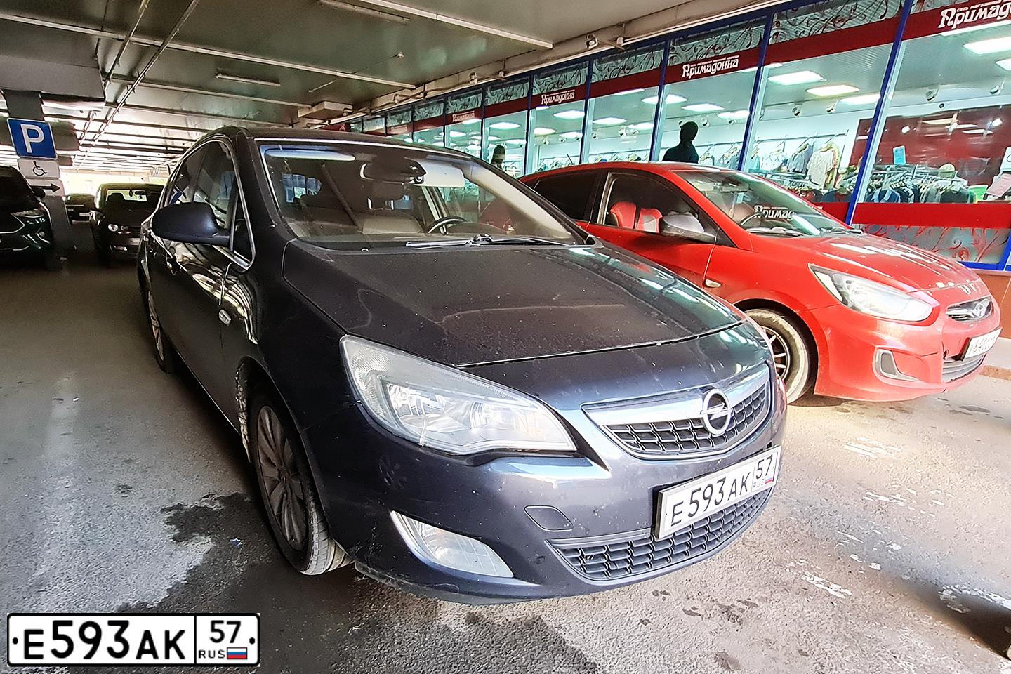 Фото автомобиля OPEL ASTRA, 2011 — госномер Е593АК57. Цвет: ЧЕРНЫЙ МЕТАЛЛИК