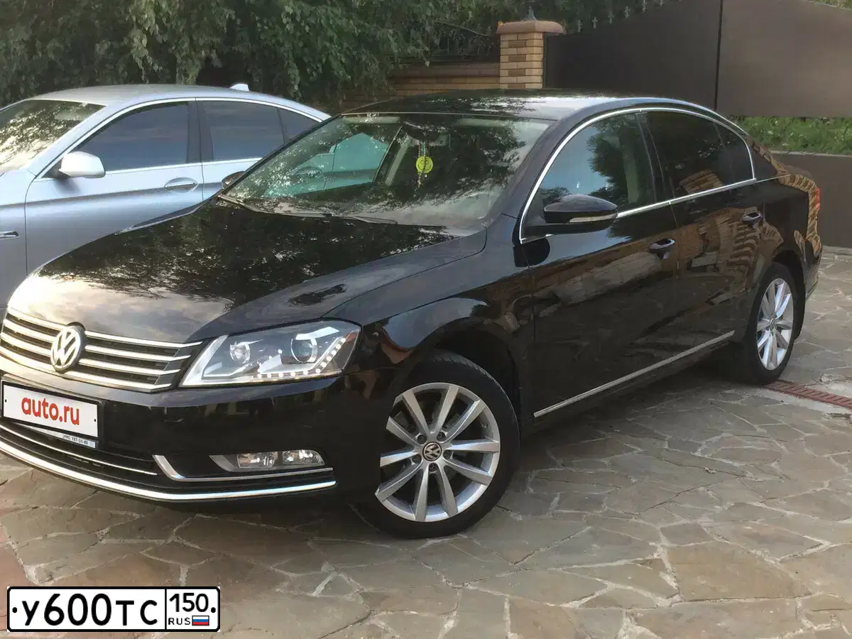 Фото автомобиля VOLKSWAGEN PASSAT, 2012 — госномер Н212УУ32. Цвет: ЧЕРНЫЙ