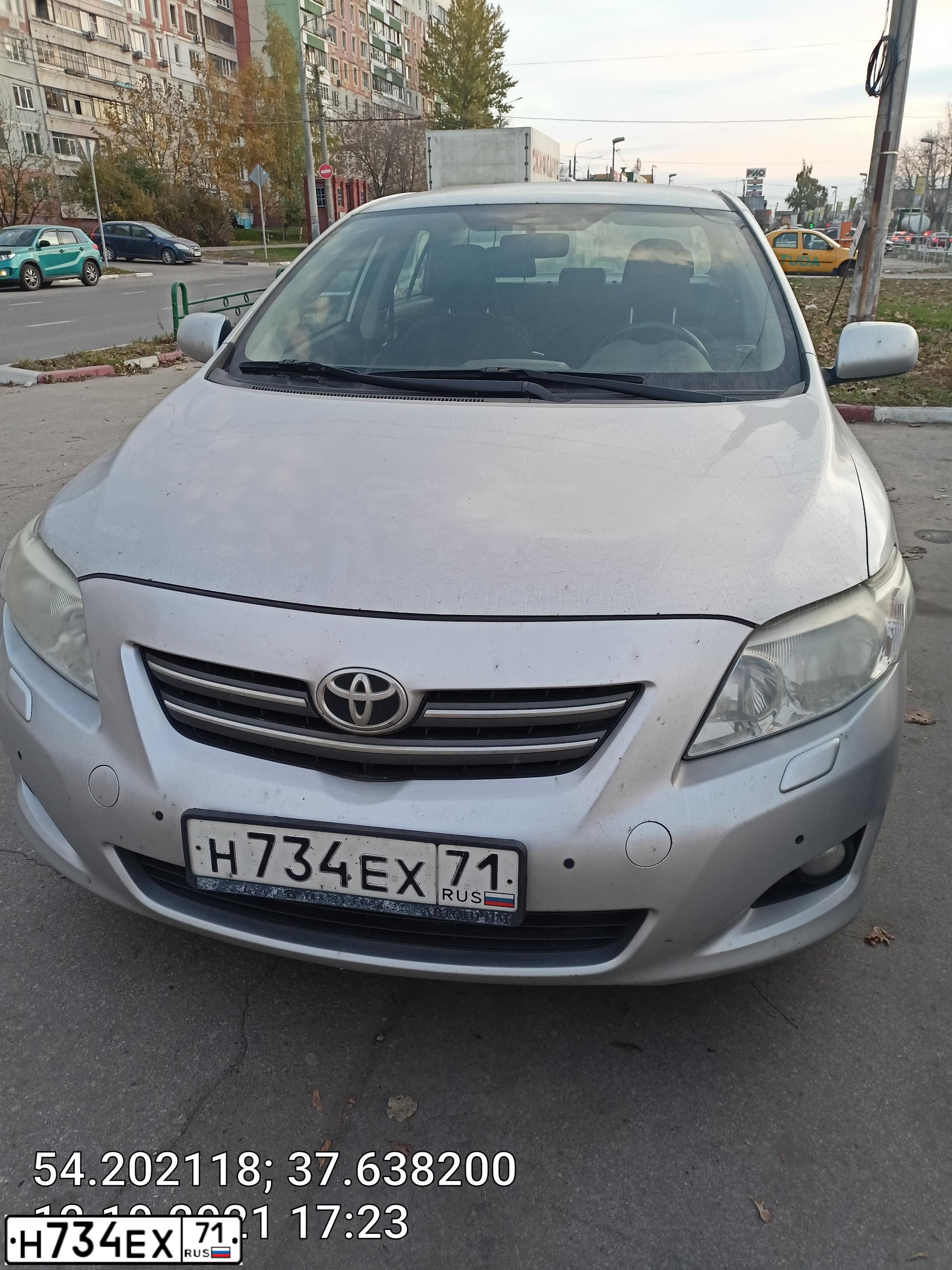 Фото автомобиля TOYOTA COROLLA, 2007 — госномер Н734ЕХ71. Цвет: СЕРЕБРИСТЫЙ