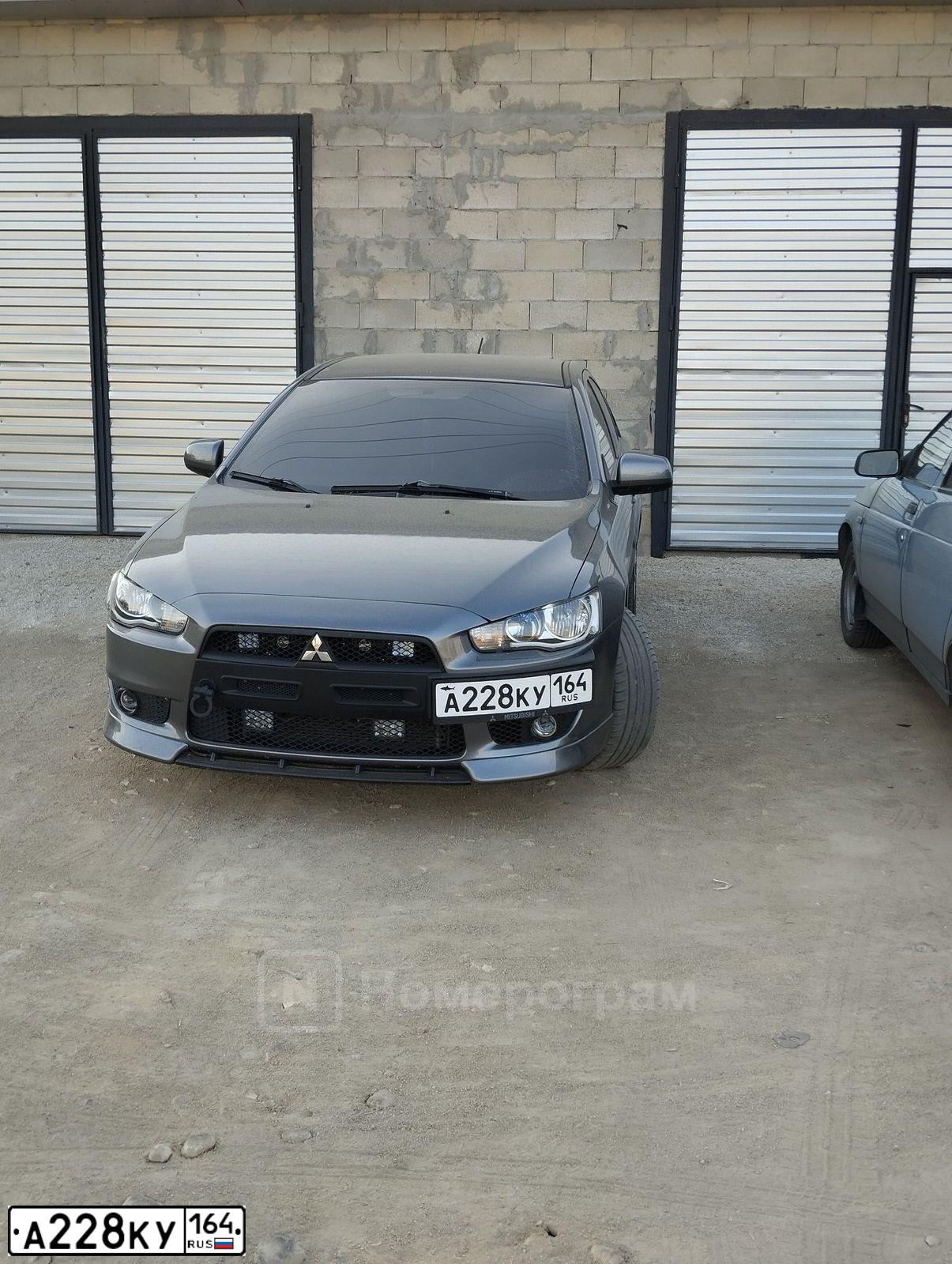 Фото автомобиля MITSUBISHI LANCER, 2008 — госномер Е875МВ761. Цвет: СЕРЫЙ