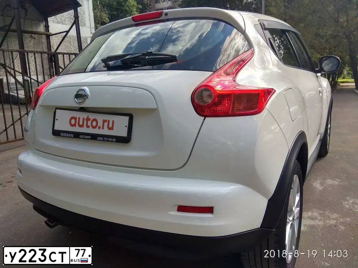 Фото автомобиля NISSAN JUKE, 2013 — госномер Н231УН32. Цвет: Белый
