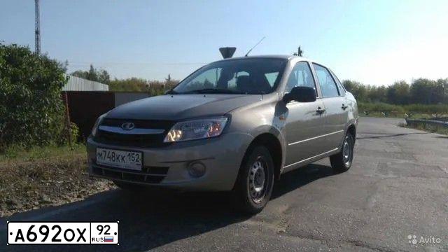 Фото автомобиля LADA 2190 GRANTA, 2013 — госномер Р753КО123. Цвет: СЕРО-БЕЖЕВЫЙ