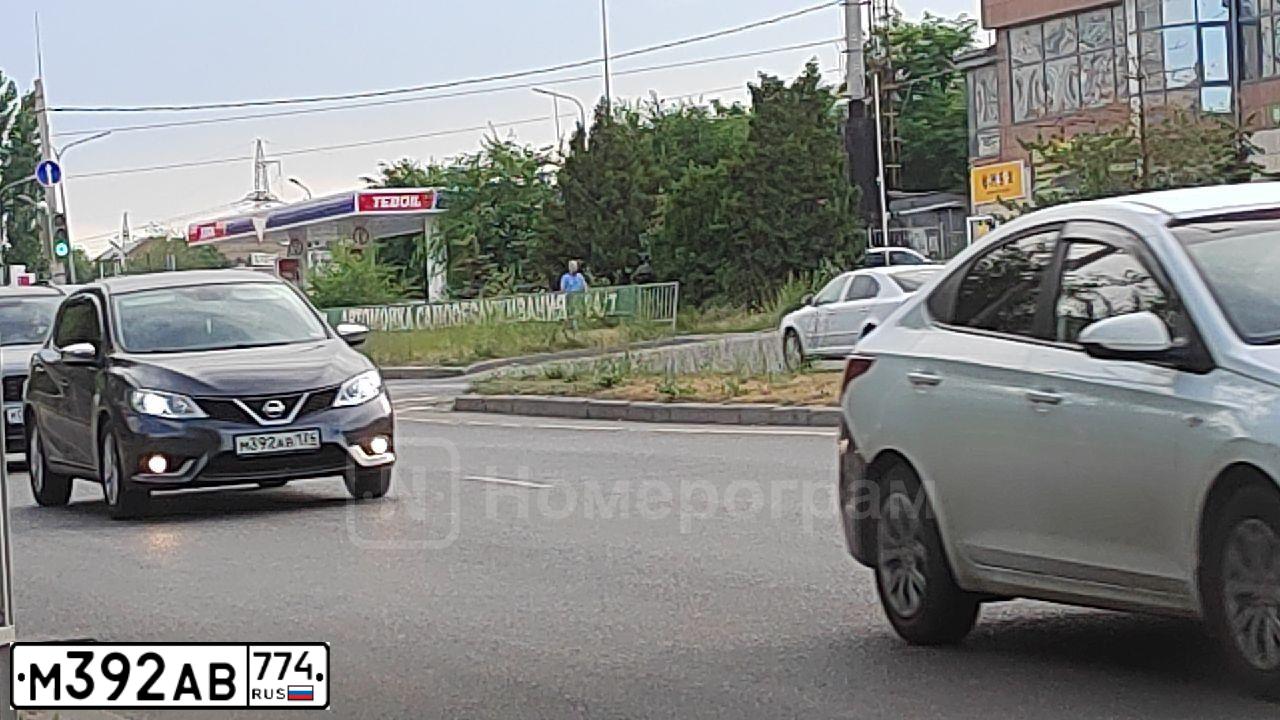 Фото автомобиля MITSUBISHI LANCER, 2007 — госномер Е581ТО702. Цвет: ЧЕРНЫЙ