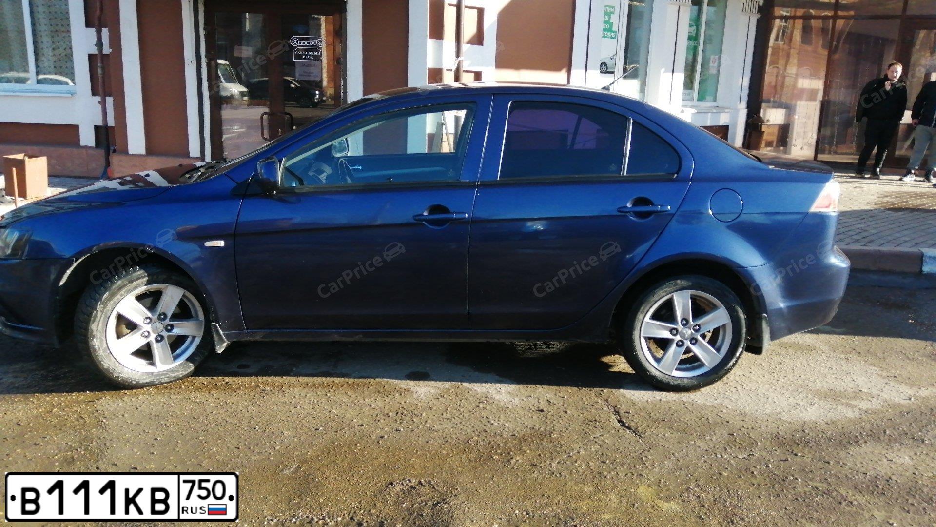 Фото автомобиля MITSUBISHI LANCER, 2008 — госномер Х989СР790. Цвет: синий