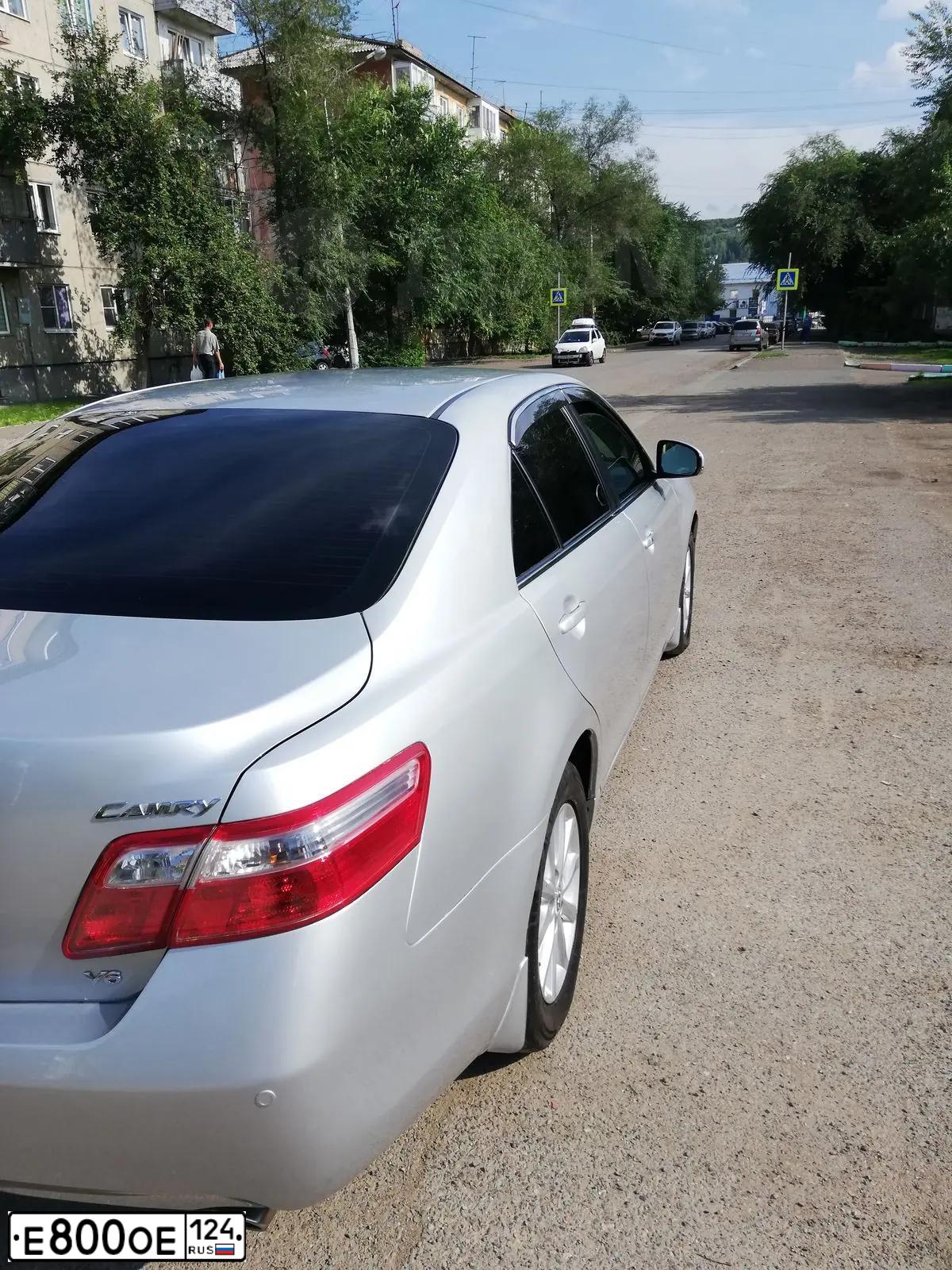 Фото автомобиля FORD FOCUS, 2006 — госномер Т126ТО124. Цвет: ТЕМНО-СЕРЫЙ