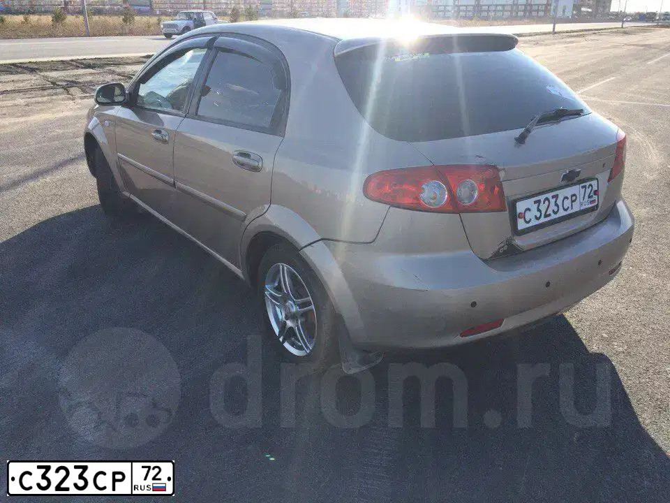 Фото автомобиля CHEVROLET LACETTI, 2008 — госномер В561НА186. Цвет: БЕЖЕВЫЙ