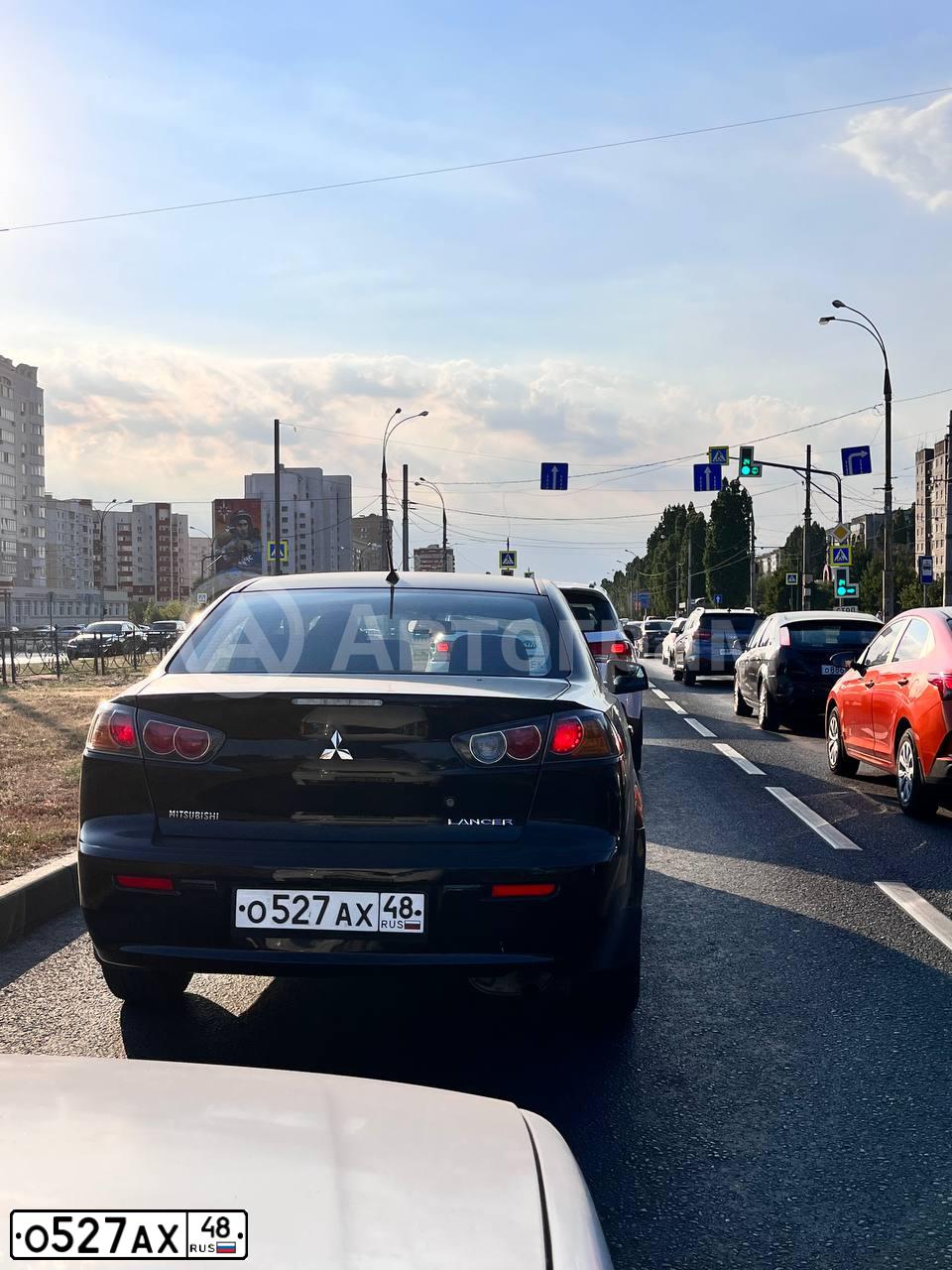 Фото автомобиля MITSUBISHI LANCER, 2011 — госномер О527АХ48. Цвет: ЧЕРНЫЙ
