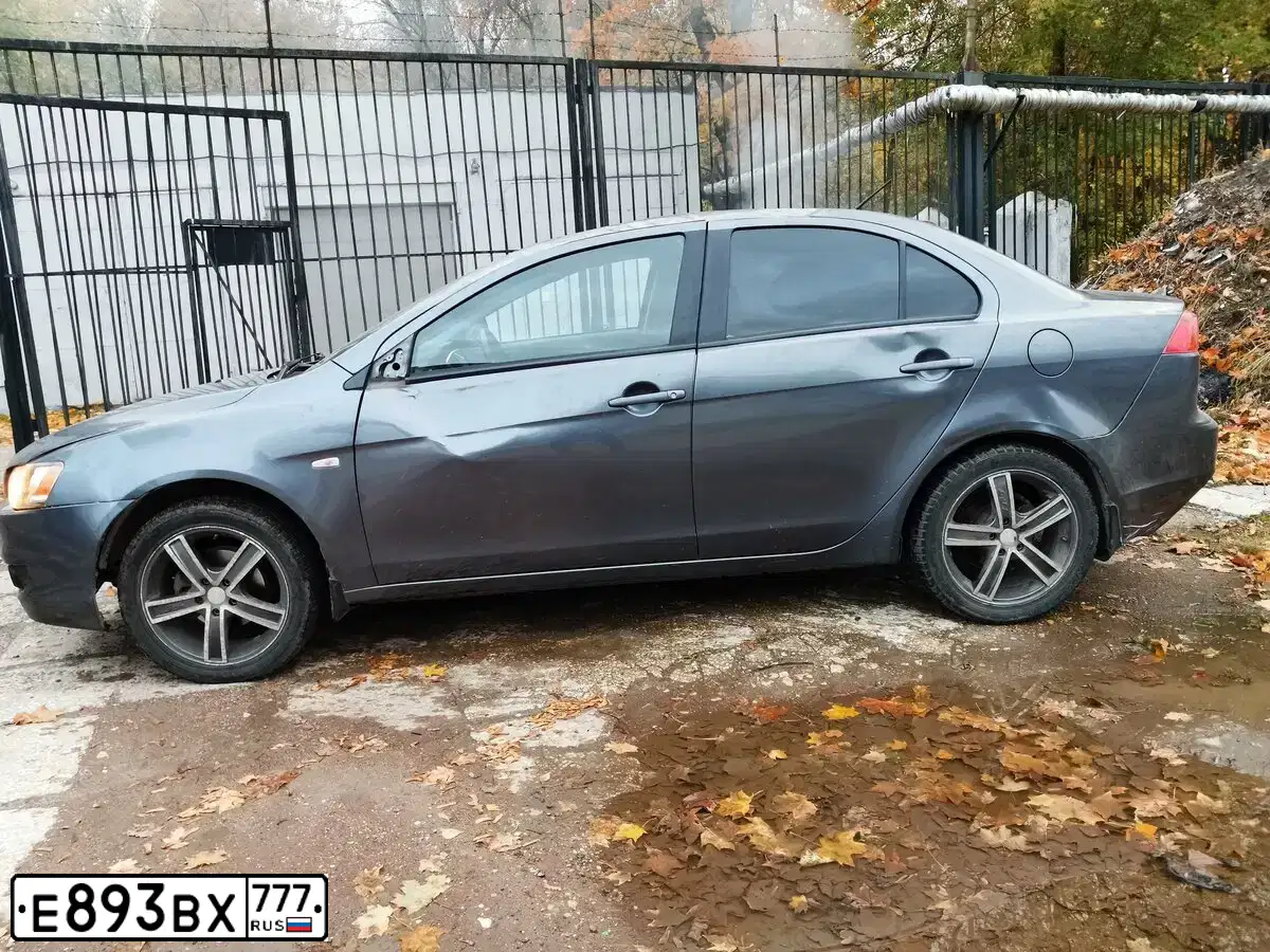 Фото автомобиля MITSUBISHI LANCER, 2008 — госномер Е893ВХ777. Цвет: СЕРЫЙ