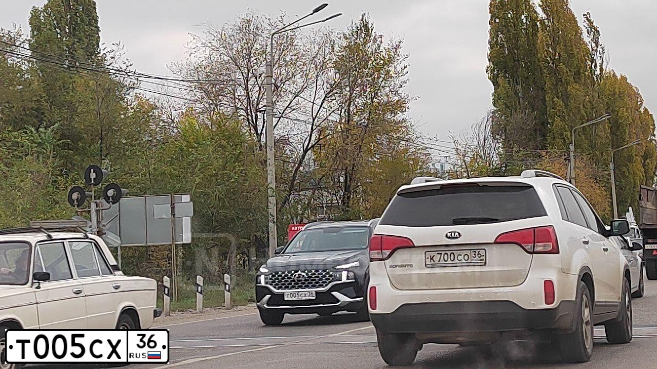 Фото автомобиля MAZDA 3, 2010 — госномер Т005СХ36. Цвет: ЧЕРНЫЙ