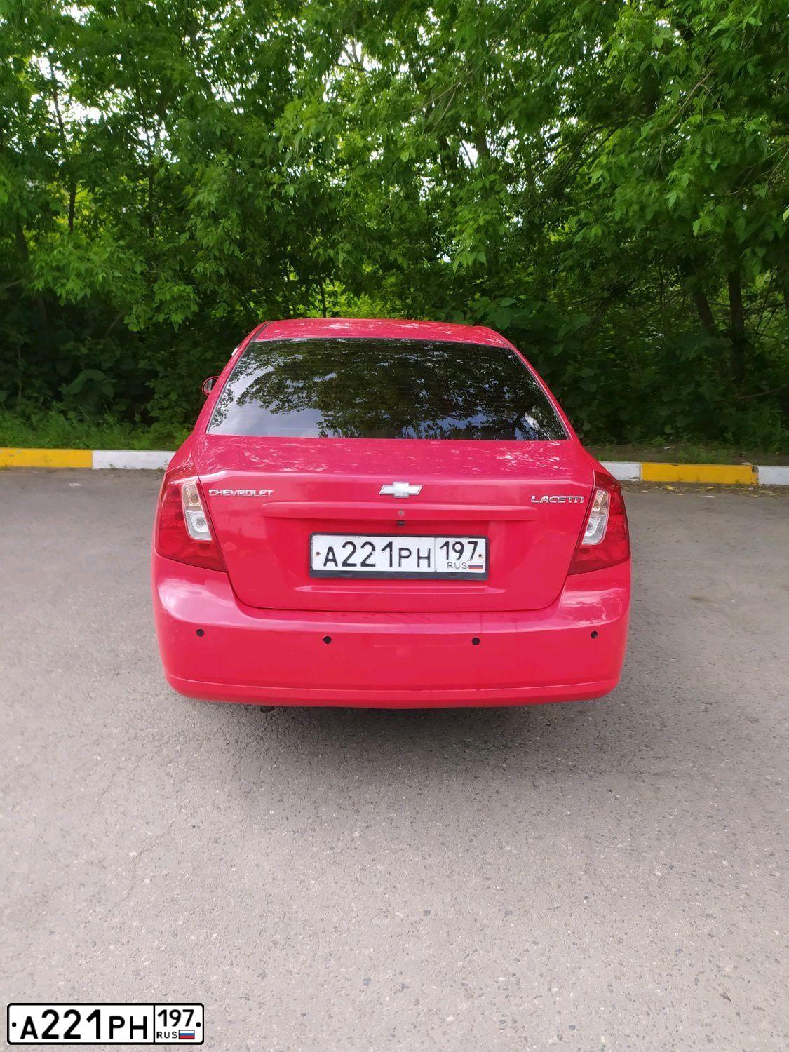 Фото автомобиля CHEVROLET LACETTI, 2006 — госномер А221РН197. Цвет: Красный