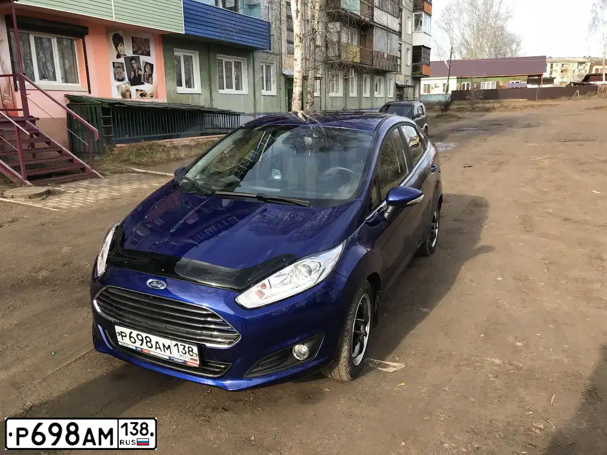 Фото автомобиля FORD FIESTA / ASPIRE, 2015 — госномер Е101НХ38. Цвет: синий