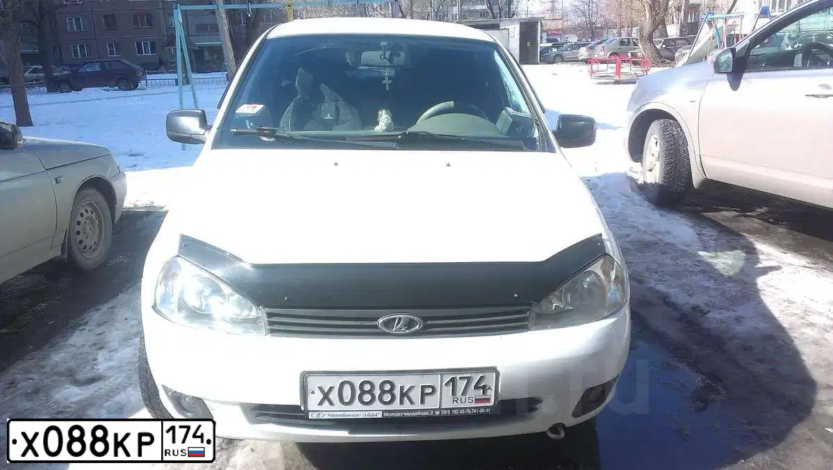 Фото автомобиля ЛАДА КАЛИНА 111730, 2010 — госномер Е161МХ45. Цвет: Белый