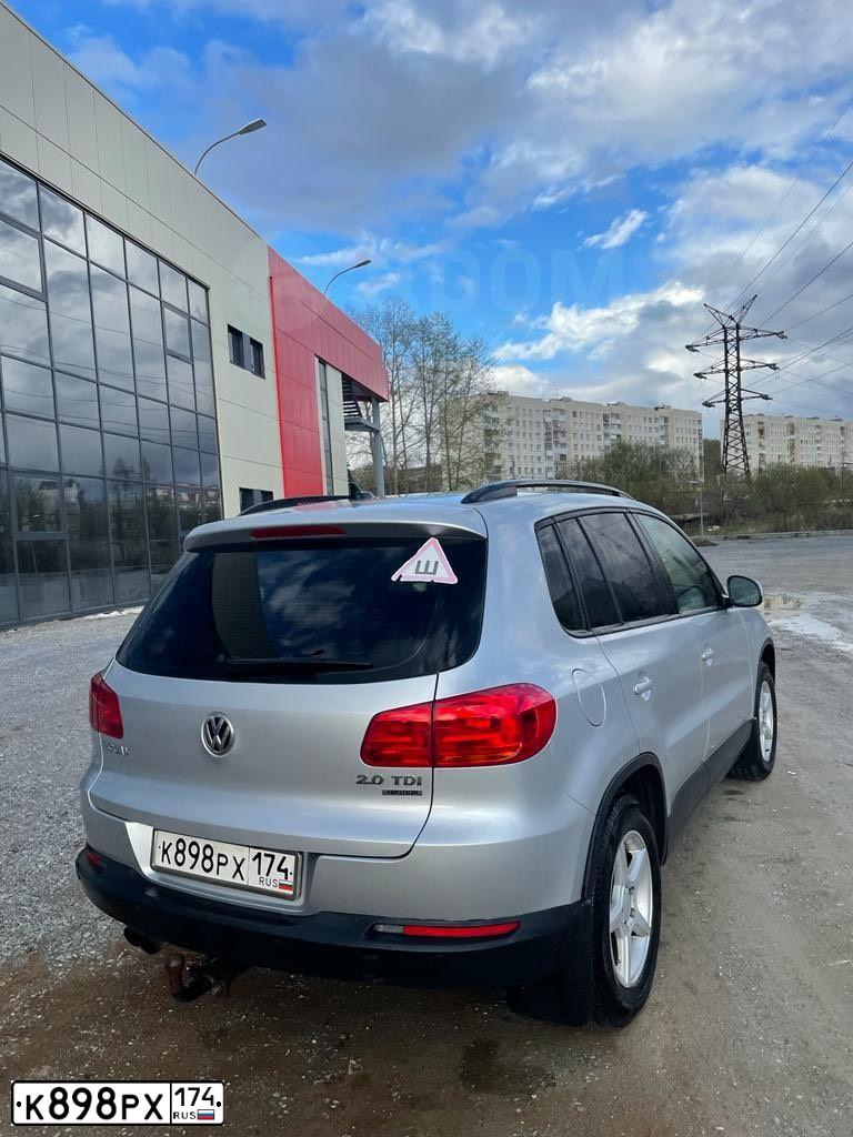 Фото автомобиля VOLKSWAGEN TIGUAN, 2014 — госномер А299ЕХ774. Цвет: СЕРЕБРИСТЫЙ