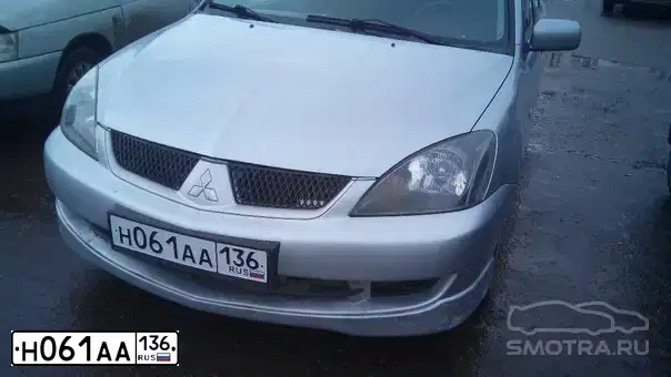 Фото автомобиля MITSUBISHI LANCER, 2006 — госномер Н077ОА177. Цвет: СЕРЕБРИСТЫЙ