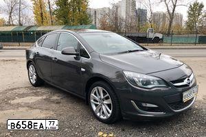 Фото автомобиля OPEL ASTRA, 2013 — госномер В658ЕА77. Цвет: СЕРЫЙ