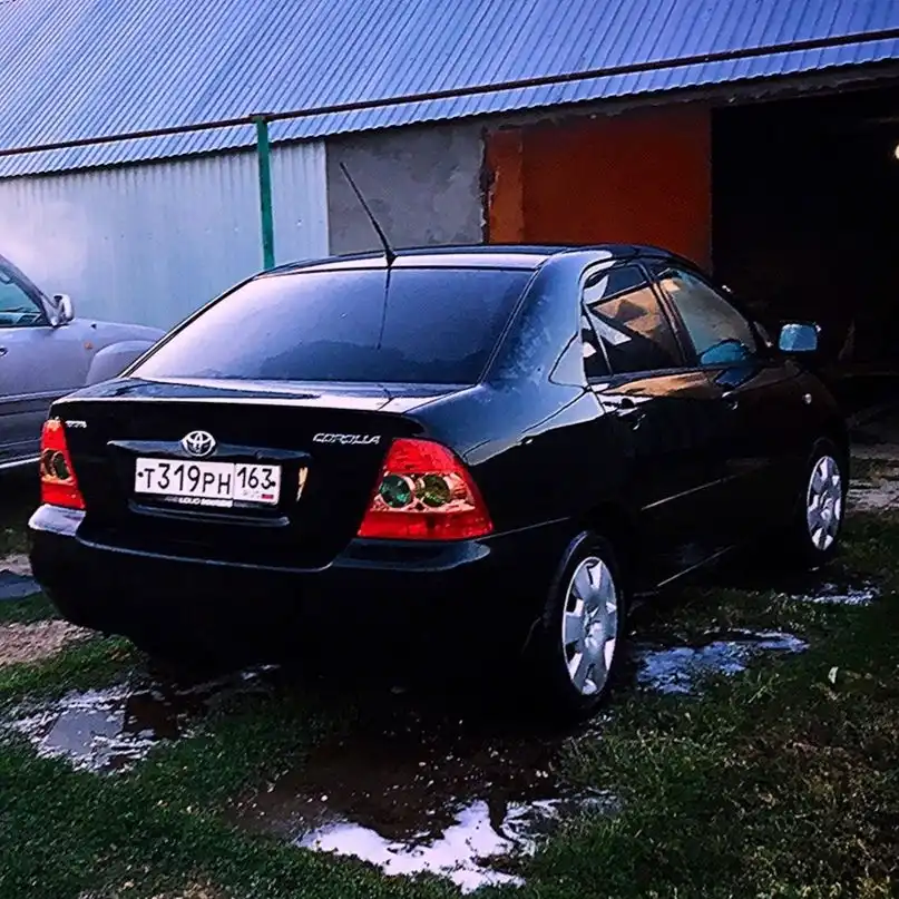 Фото автомобиля TOYOTA COROLLA, 2004 — госномер Т319РН163. Цвет: ЧЕРНЫЙ