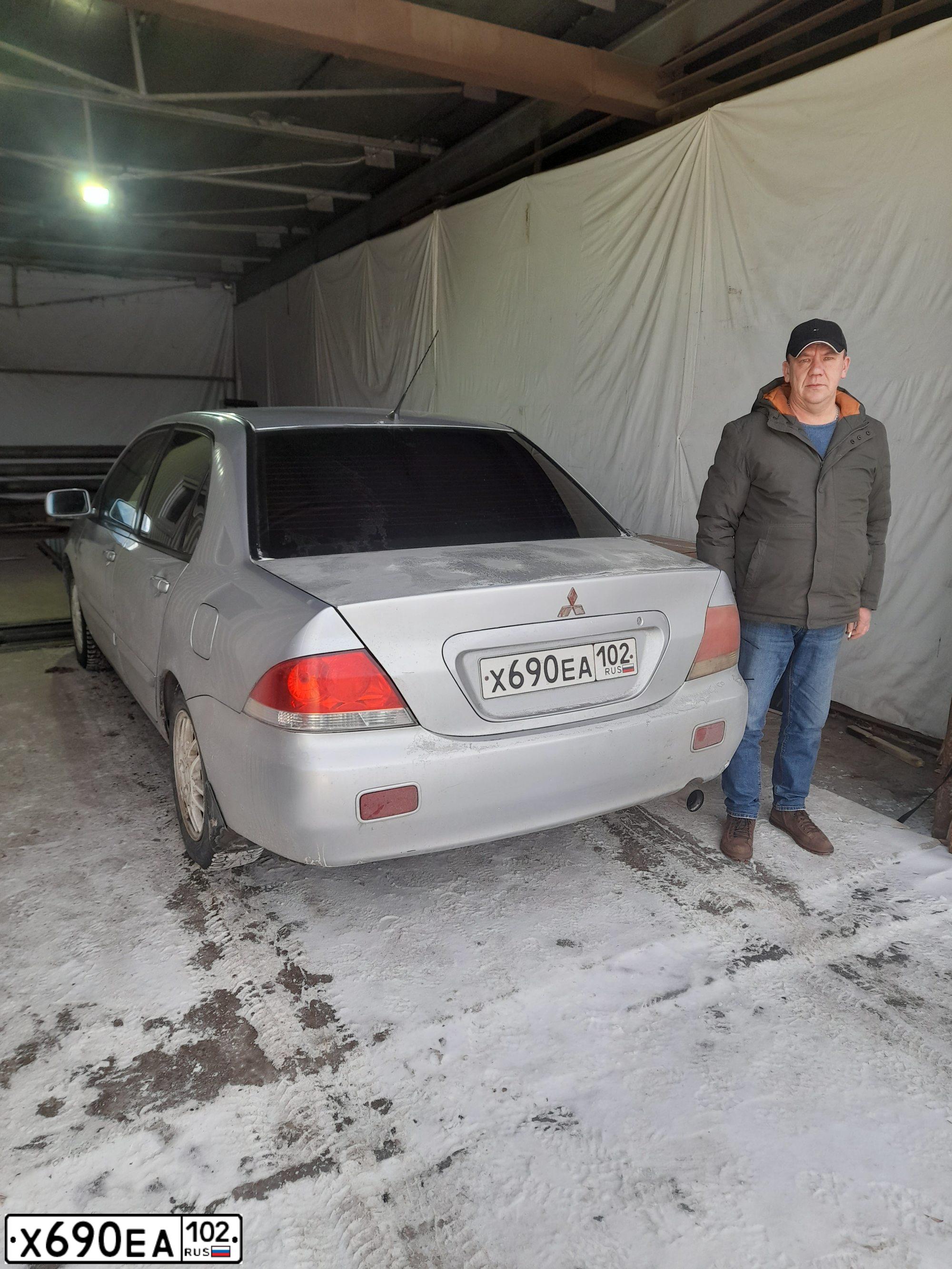 Фото автомобиля MITSUBISHI LANCER, 2005 — госномер Е017СВ702. Цвет: Серебристый