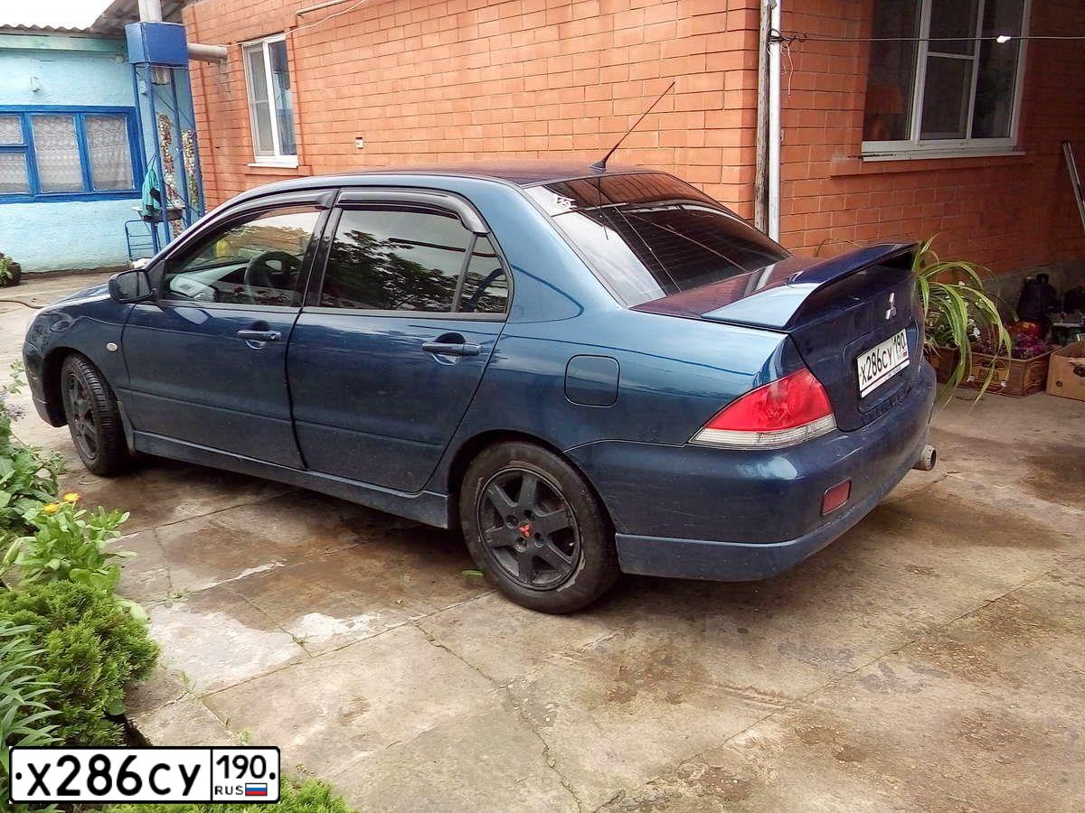 Фото автомобиля MITSUBISHI LANCER, 2004 — госномер Р964ЕТ761. Цвет: синий