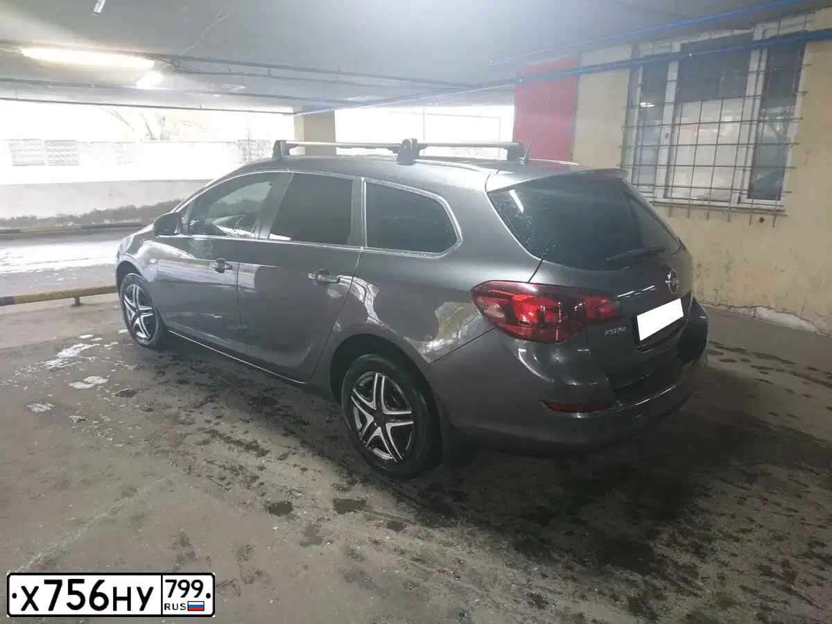 Фото автомобиля OPEL ASTRA, 2012 — госномер Х756НУ799. Цвет: ТЕМНО-СЕРЫЙ