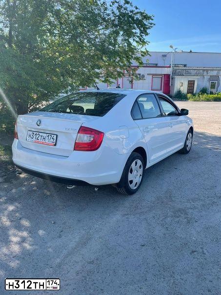 Фото автомобиля SKODA RAPID, 2014 — госномер Н312ТН174. Цвет: Белый