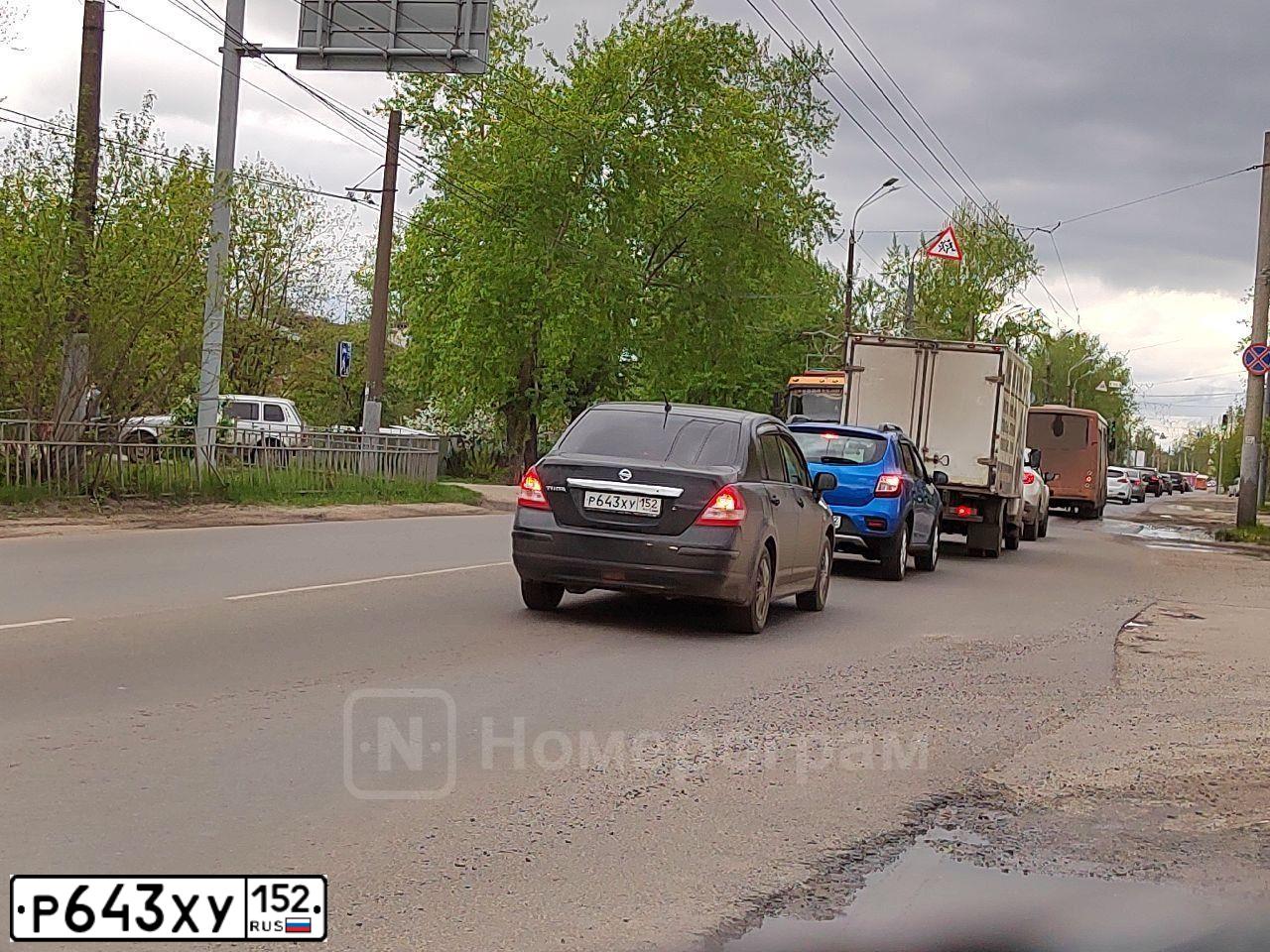Фото автомобиля NISSAN TIIDA, 2013 — госномер Н618ВТ50. Цвет: ЧЕРНЫЙ