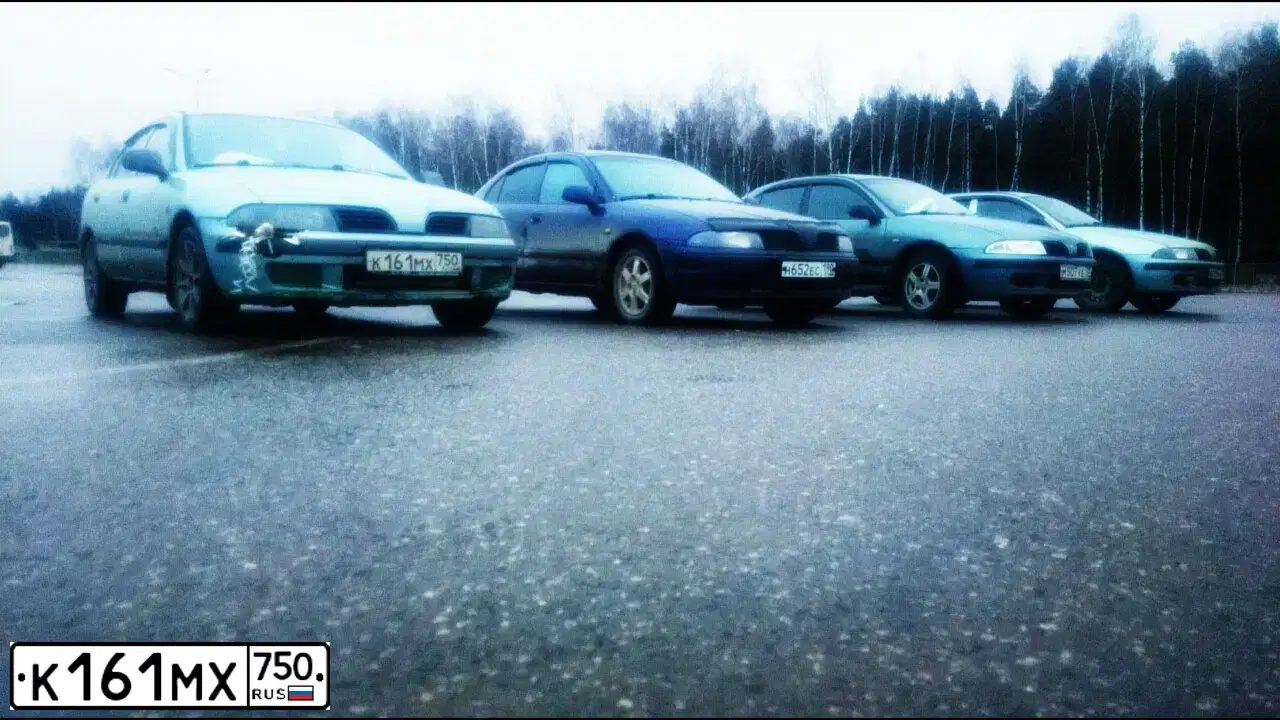 Фото автомобиля MITSUBISHI CARISMA, 2002 — госномер К161МХ750. Цвет: СЕРО-ЗЕЛЕНЫЙ